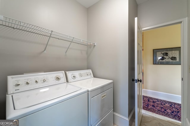 laundry room featuring washing machine and clothes dryer