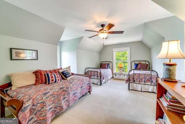 bedroom with light carpet, ceiling fan, and lofted ceiling