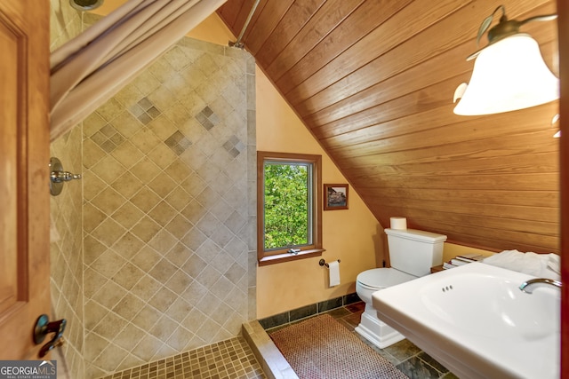 bathroom with sink, wooden ceiling, tile patterned floors, vaulted ceiling, and toilet