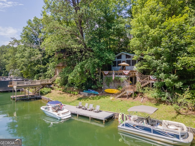 view of dock featuring a deck with water view