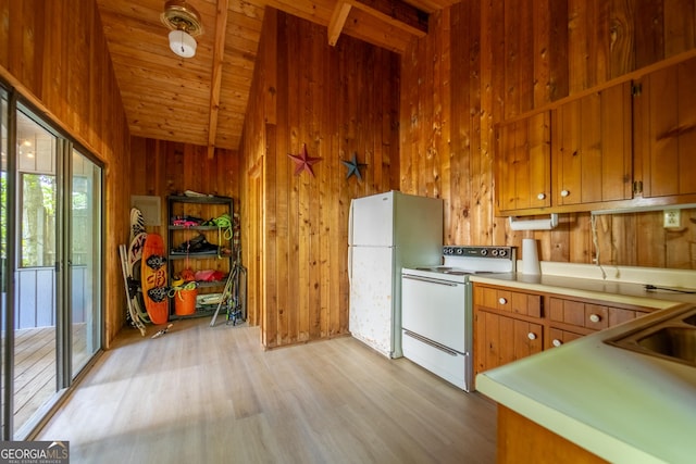 kitchen featuring white appliances, lofted ceiling with beams, wooden walls, light hardwood / wood-style flooring, and wood ceiling