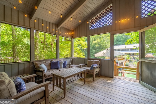 sunroom / solarium with vaulted ceiling with beams and wood ceiling