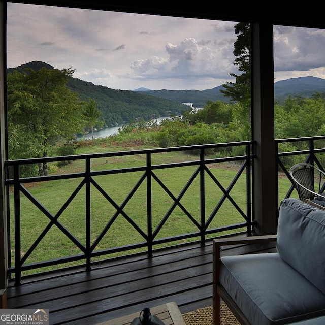 balcony with a water and mountain view