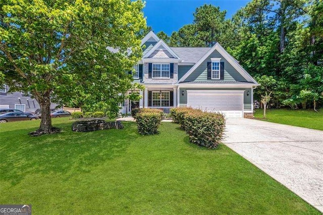 view of front facade with a garage and a front lawn