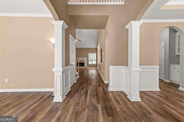 hall with dark hardwood / wood-style floors and ornamental molding