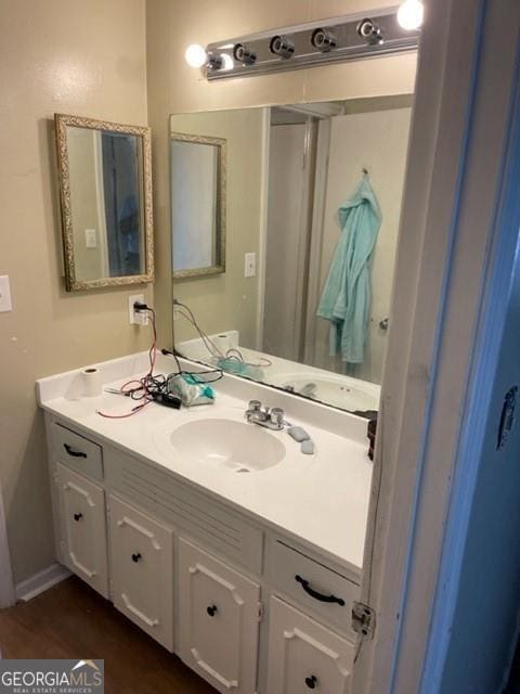 bathroom with wood-type flooring and vanity