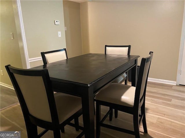 dining area featuring light wood-type flooring