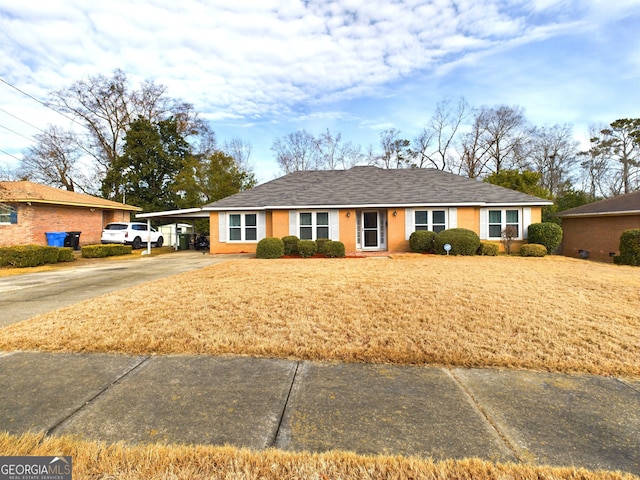 ranch-style home with a carport