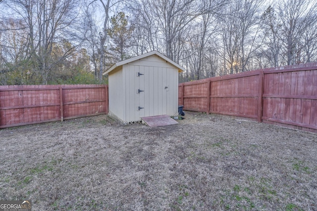 view of shed with a fenced backyard