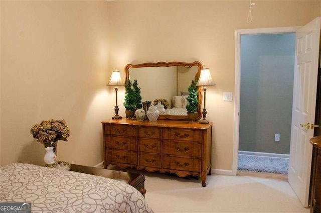 bedroom with light colored carpet