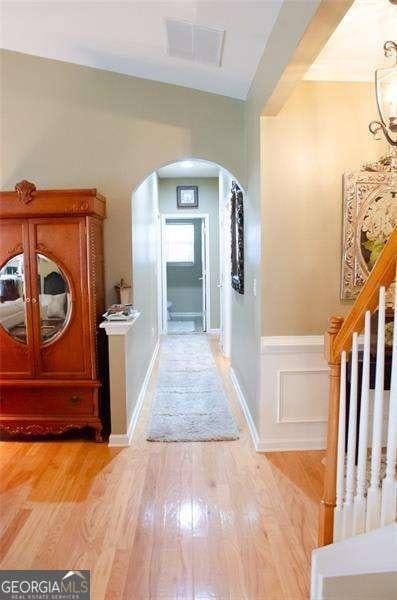 hall with light hardwood / wood-style floors