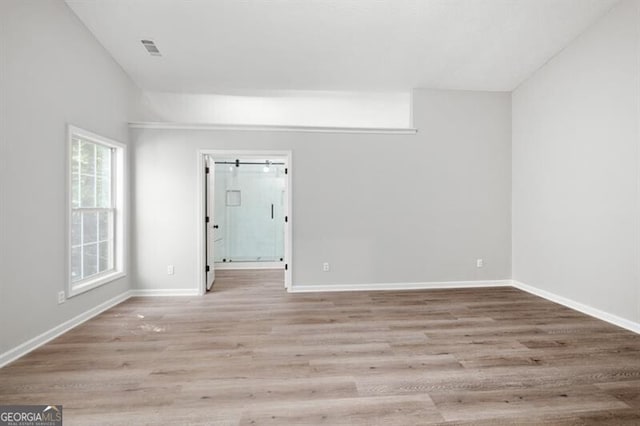 spare room with light hardwood / wood-style floors