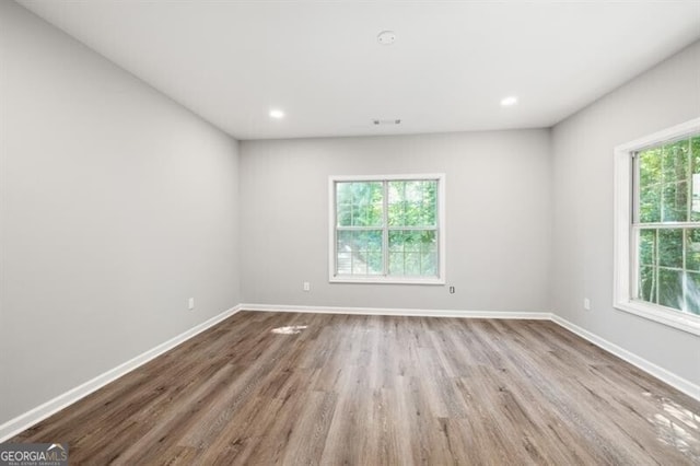 spare room featuring light wood-type flooring