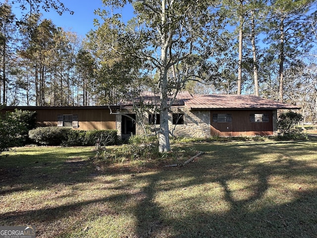 back of house with a yard