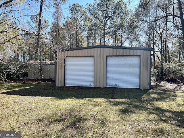 garage featuring a lawn