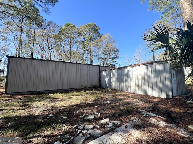 view of home's exterior featuring an outdoor structure