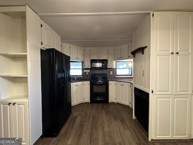 kitchen with black appliances, dark hardwood / wood-style flooring, white cabinets, and sink