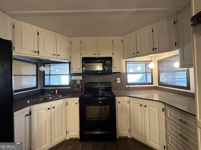 kitchen with white cabinets, sink, a healthy amount of sunlight, and black appliances