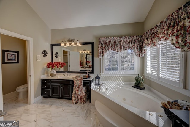 bathroom with a bathing tub, vanity, toilet, and lofted ceiling