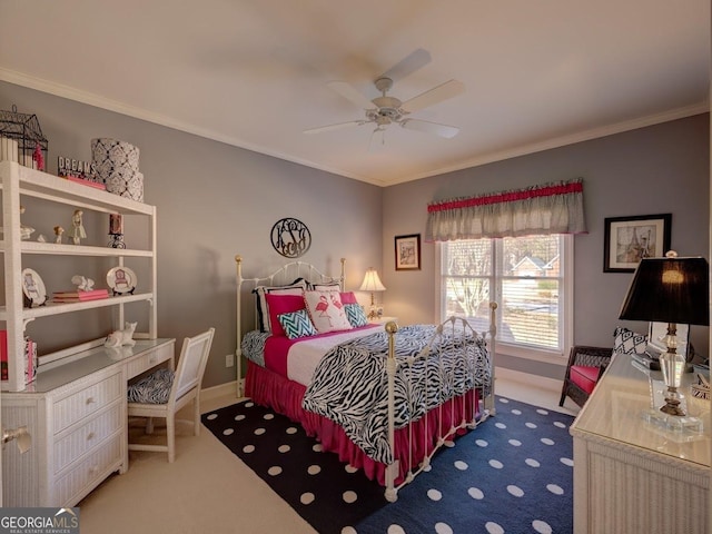 carpeted bedroom with ceiling fan and crown molding