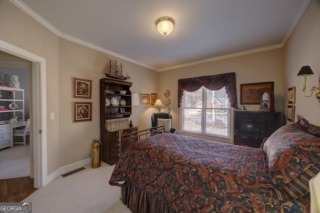 bedroom featuring carpet flooring and crown molding