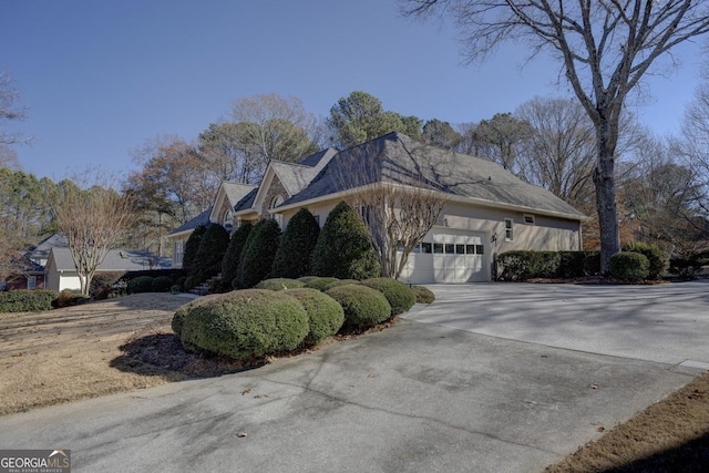 view of side of property featuring a garage