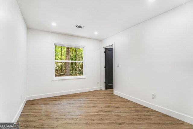 empty room with light hardwood / wood-style floors