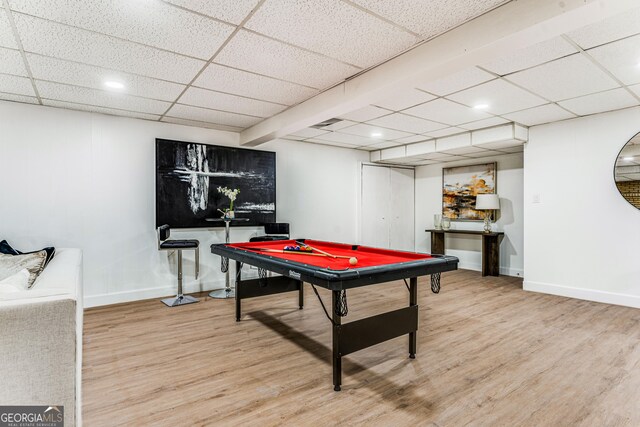 playroom featuring hardwood / wood-style floors, a drop ceiling, and pool table