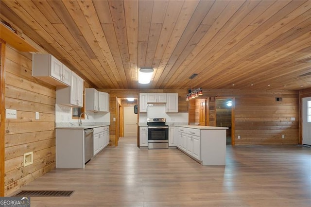 kitchen with white cabinetry, wooden ceiling, pendant lighting, and appliances with stainless steel finishes