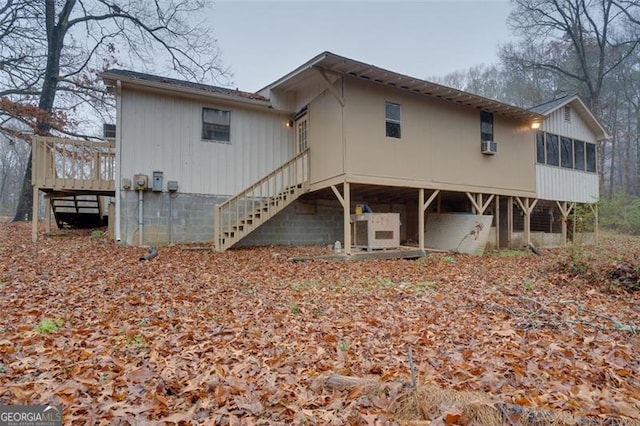 rear view of house featuring a sunroom