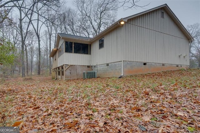 view of side of home featuring cooling unit