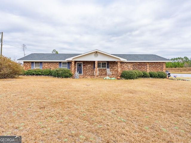 ranch-style home with a front lawn