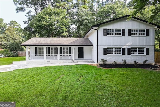 view of front facade with a porch and a front yard