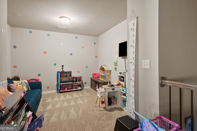 recreation room featuring carpet flooring