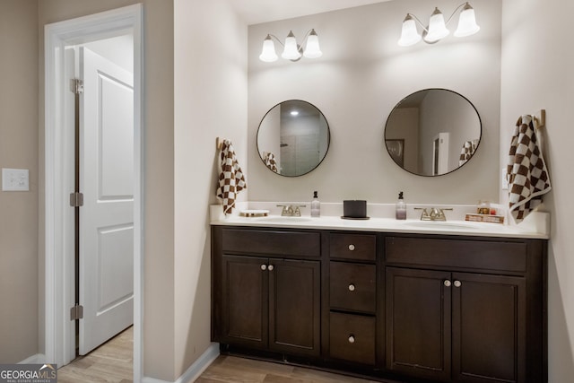 bathroom with wood-type flooring and vanity