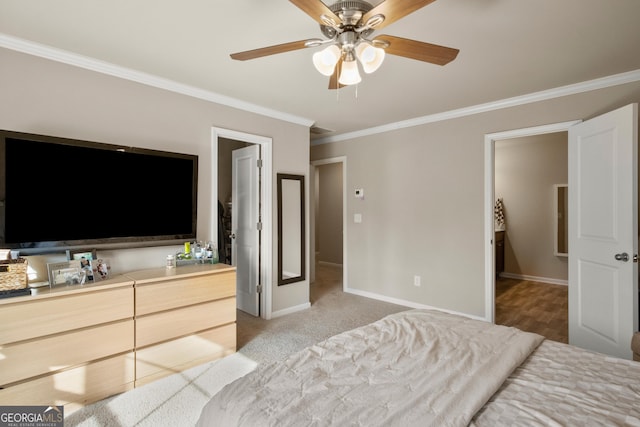 bedroom with ceiling fan, ornamental molding, and light carpet