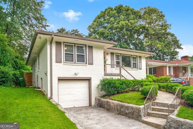 split level home featuring a garage and a front yard