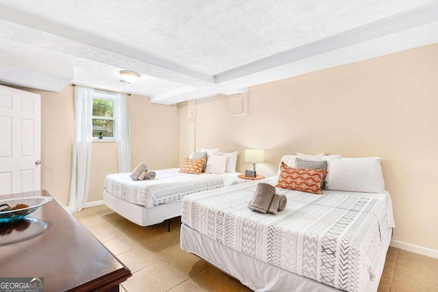 tiled bedroom with a textured ceiling