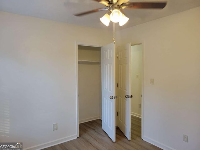 unfurnished bedroom featuring a closet, ceiling fan, and light hardwood / wood-style floors