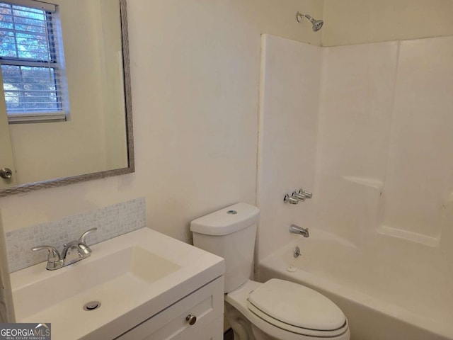 full bathroom with vanity, tasteful backsplash, toilet, and shower / washtub combination