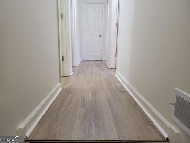 hallway featuring light hardwood / wood-style flooring