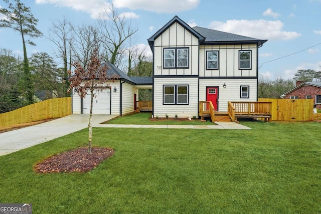 view of front of property featuring a front lawn and a garage