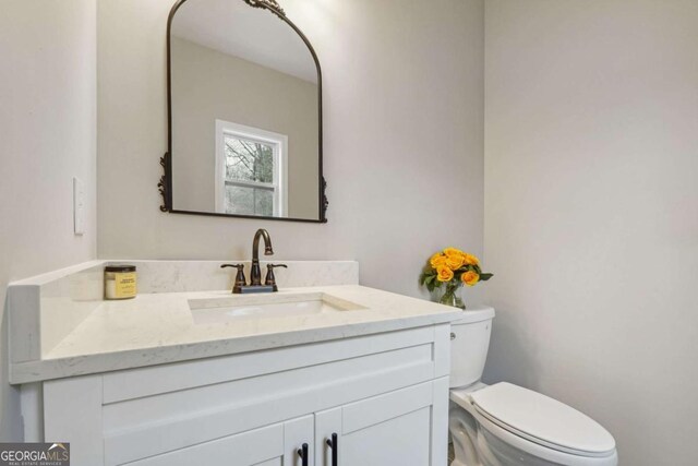 bathroom with vanity and toilet