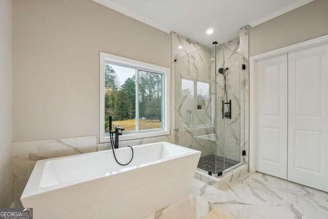 bathroom with shower with separate bathtub