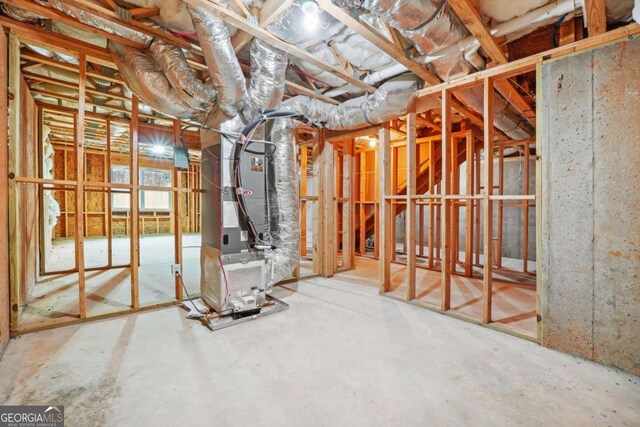 basement featuring heating unit