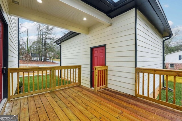 deck featuring a lawn