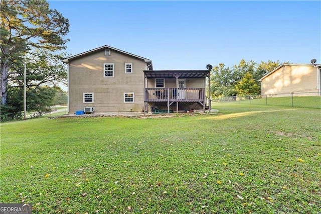 back of property featuring a yard, a pergola, cooling unit, and a wooden deck