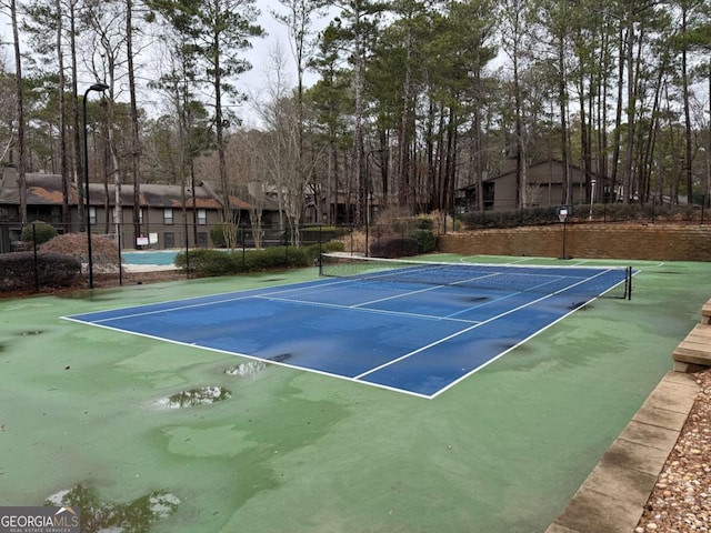 view of tennis court with basketball court