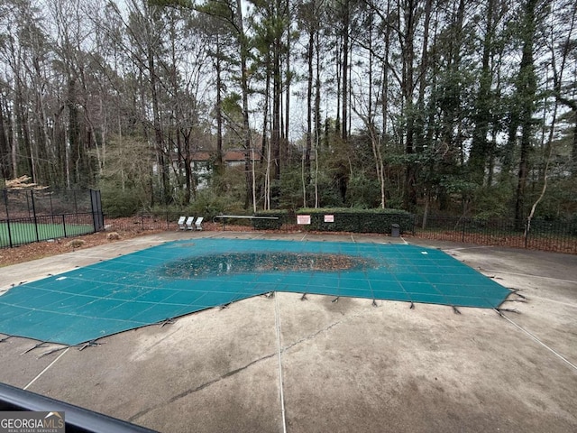 view of swimming pool featuring a patio area