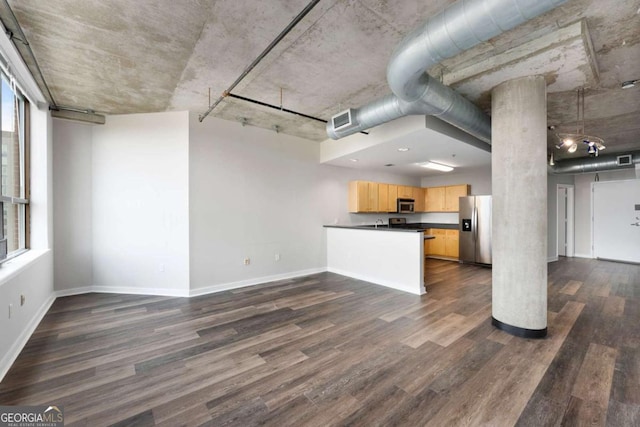 unfurnished living room featuring dark hardwood / wood-style flooring